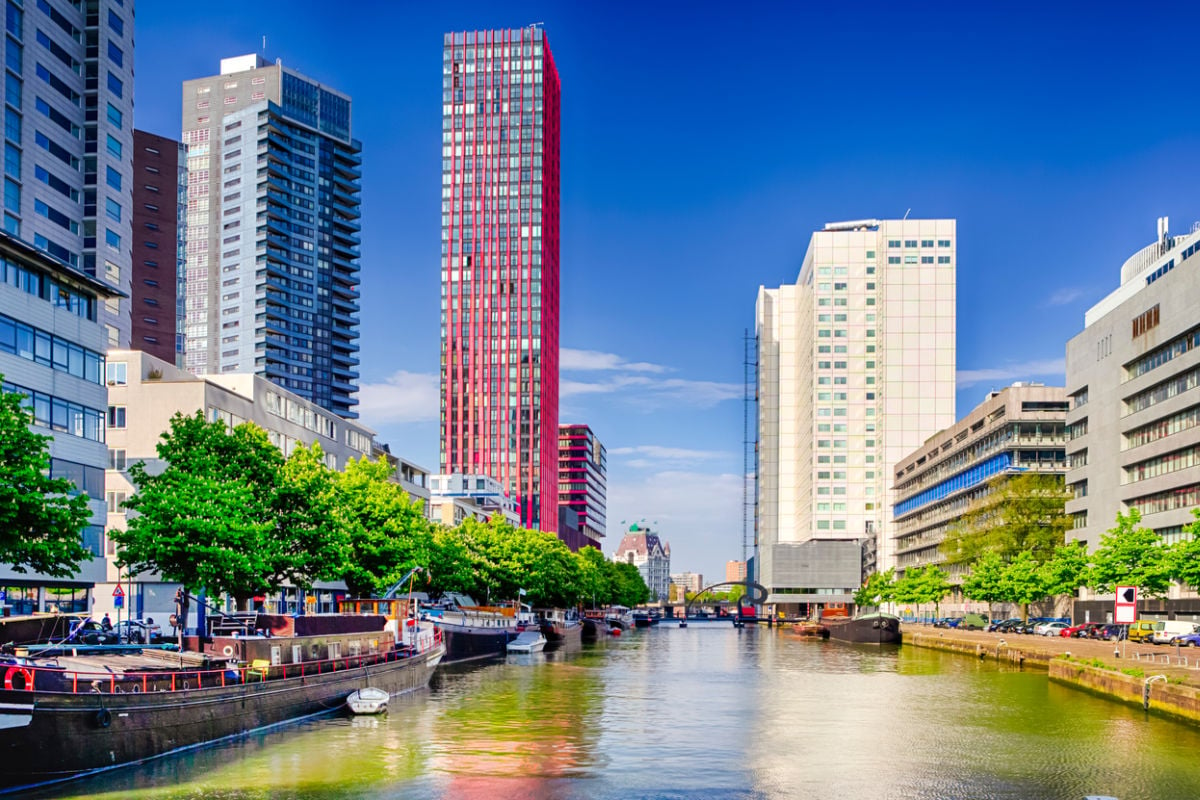 Canal running through modern skyline of Rotterdam